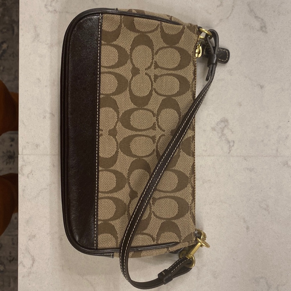 Coach monogram purse.  Small brown with leather accents.